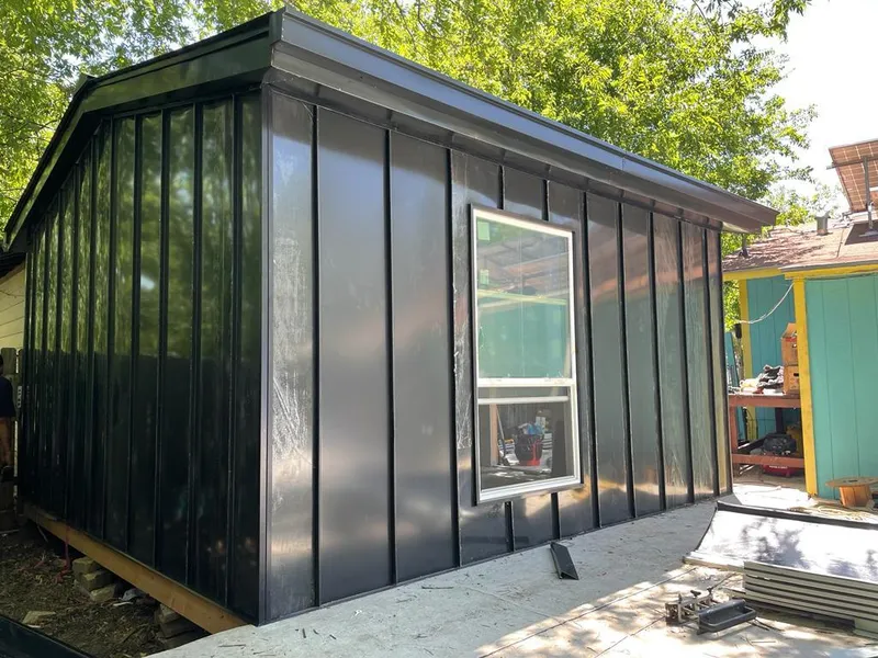 Black standing seam metal wall panels for Roof Inspection in Humble