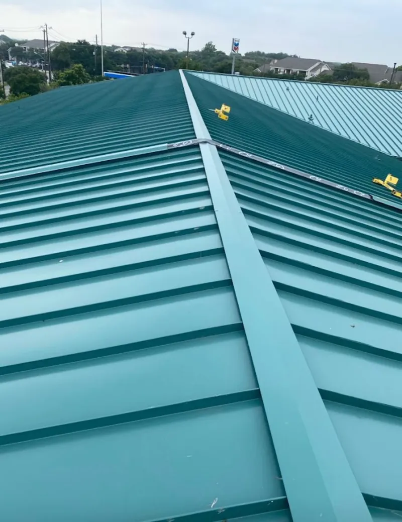 Green commercial metal roof ridge and valley for Metal Roof Repair in Humble